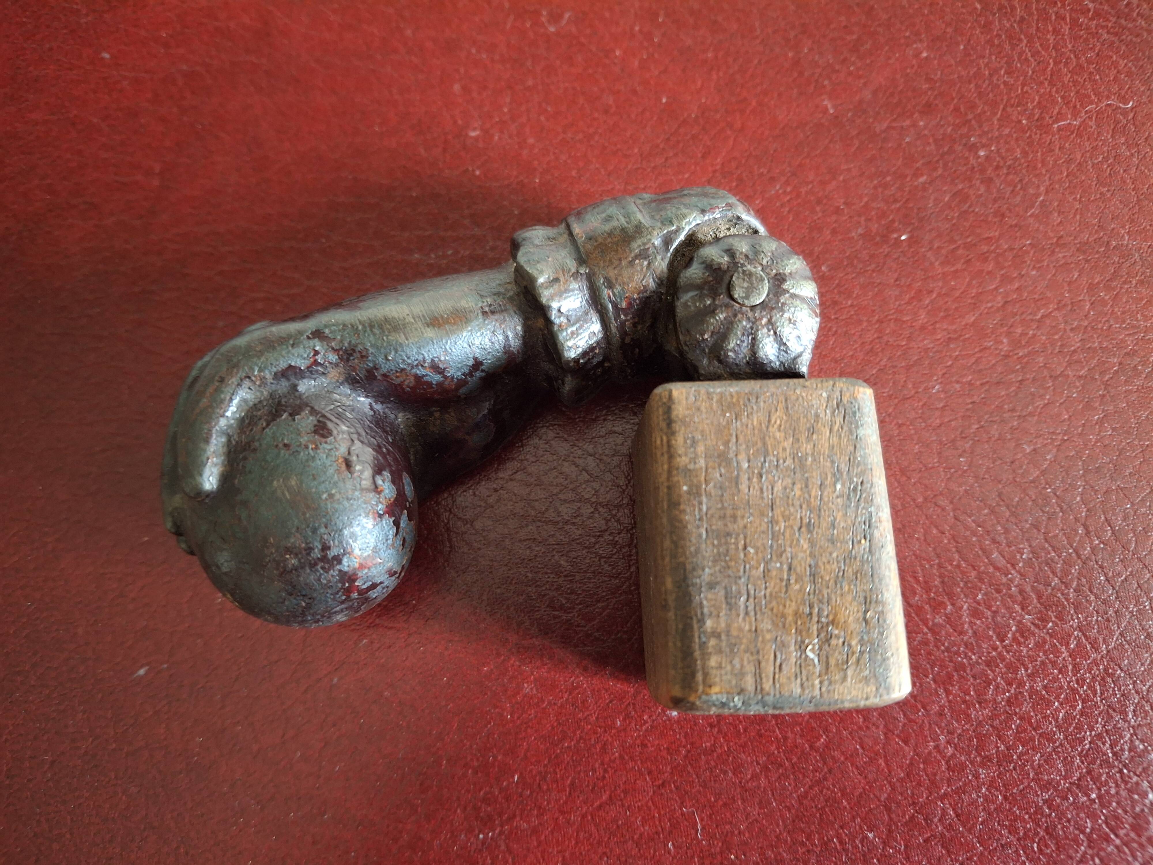 Cast iron door knocker from the 19th century or earlier.