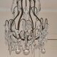 brass cage chandelier with crystal tassels