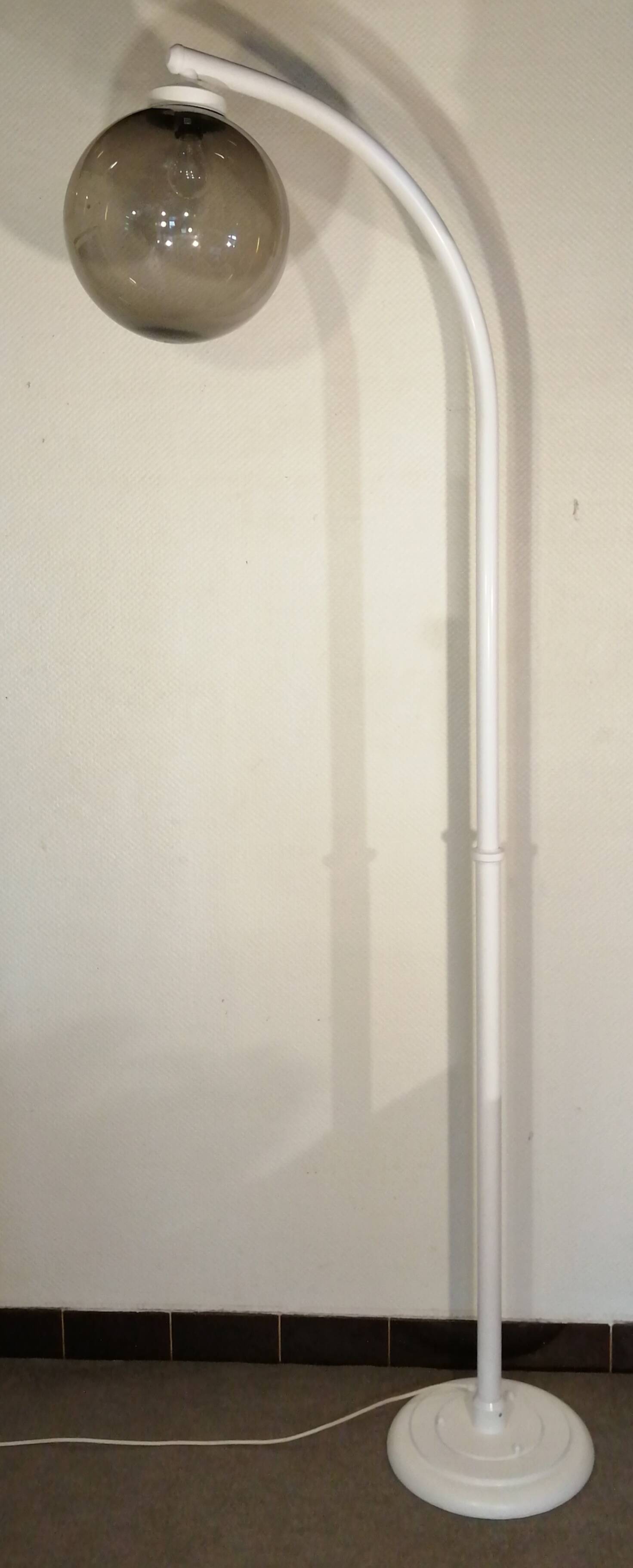 Adjustable metal floor lamp with its vintage smoked ball model from Roger Pradier 1970