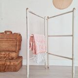 Old towel rack in patinated white wood