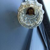 Suspension in molded glass golden reflection