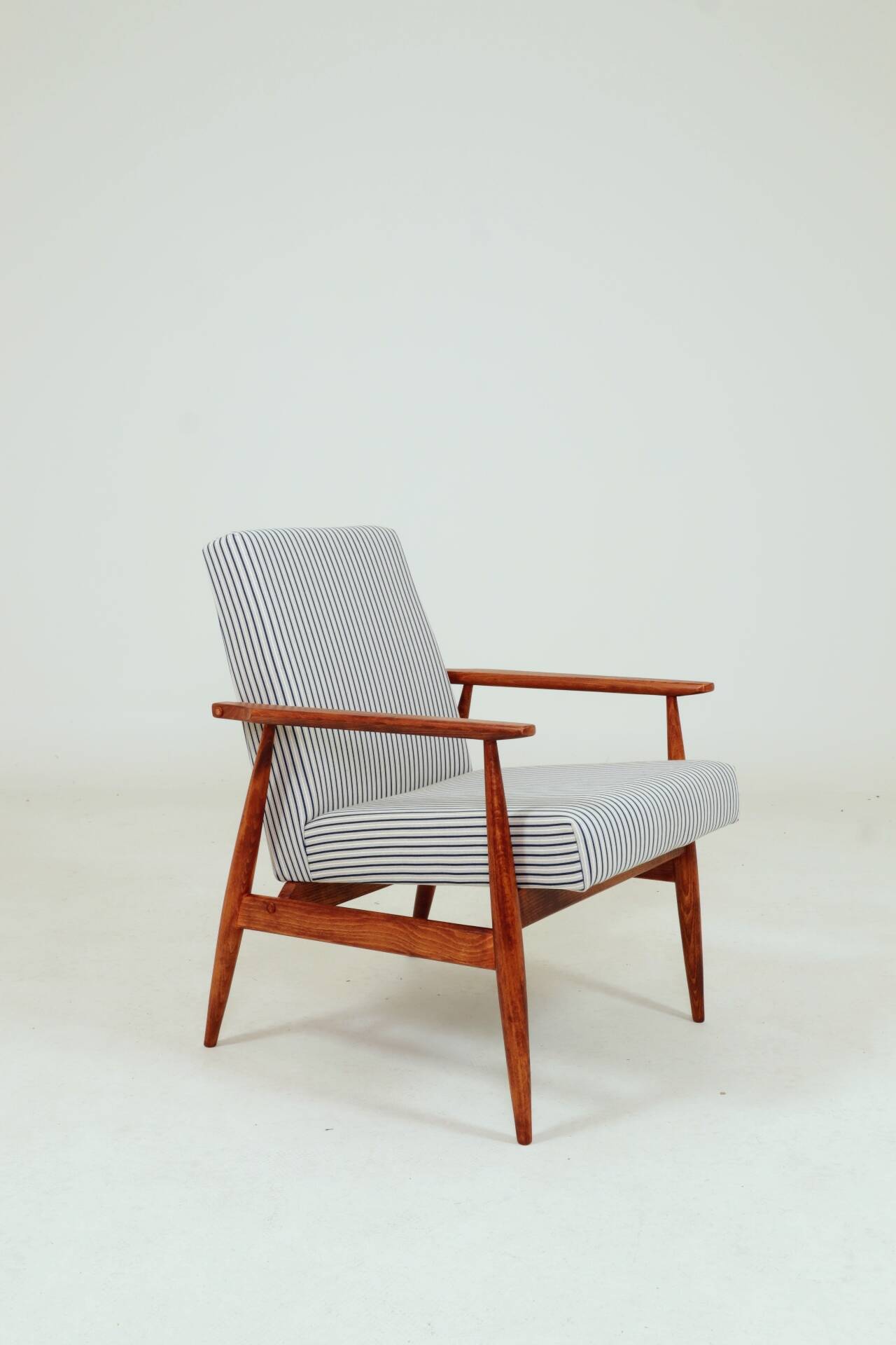 Armchair with striped fabric footrest, 1960