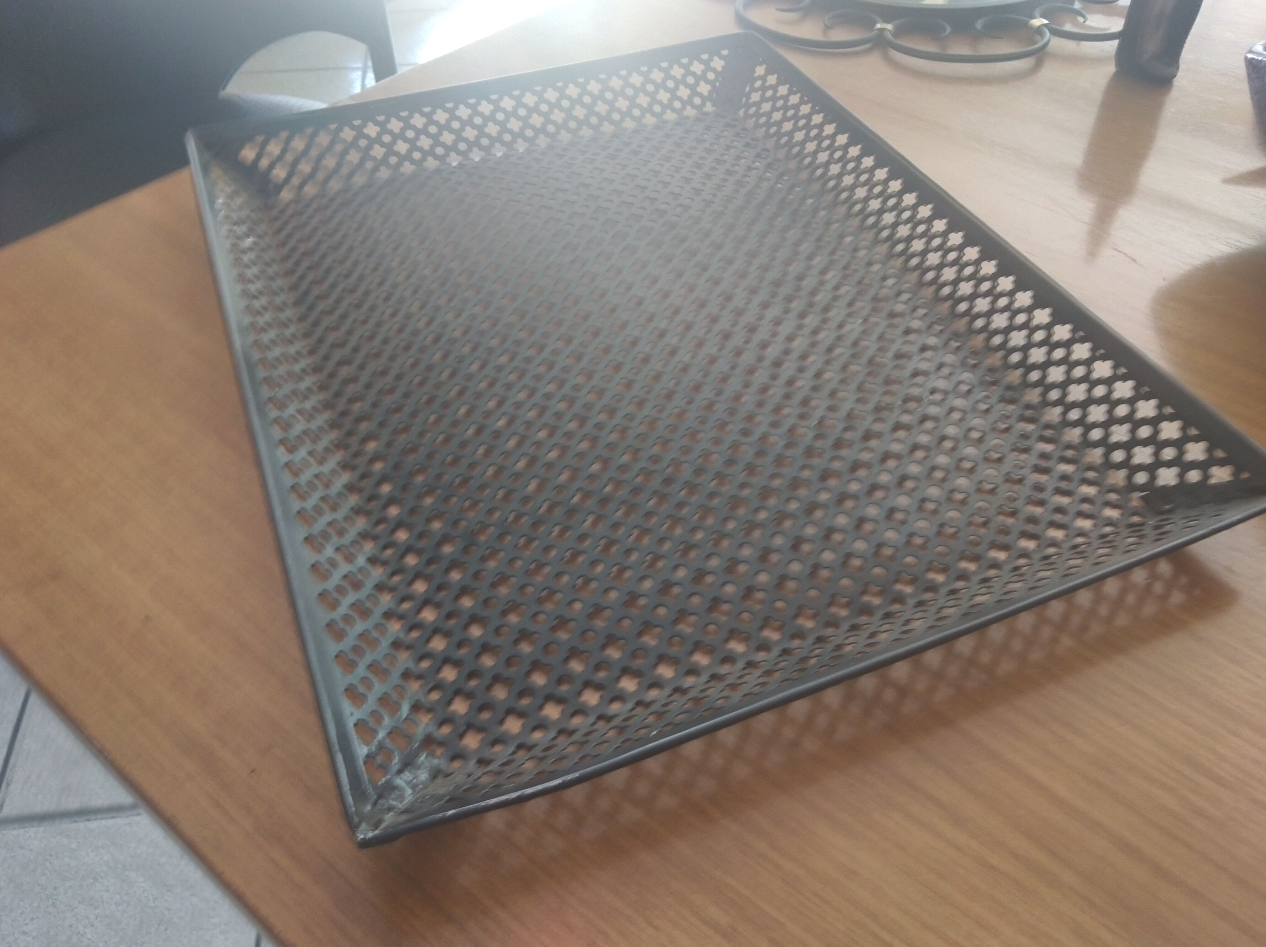 Perforated sheet metal tray, circa 1950