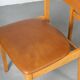 Set of 6 Danish dining chairs made of beech and brown leatherette.