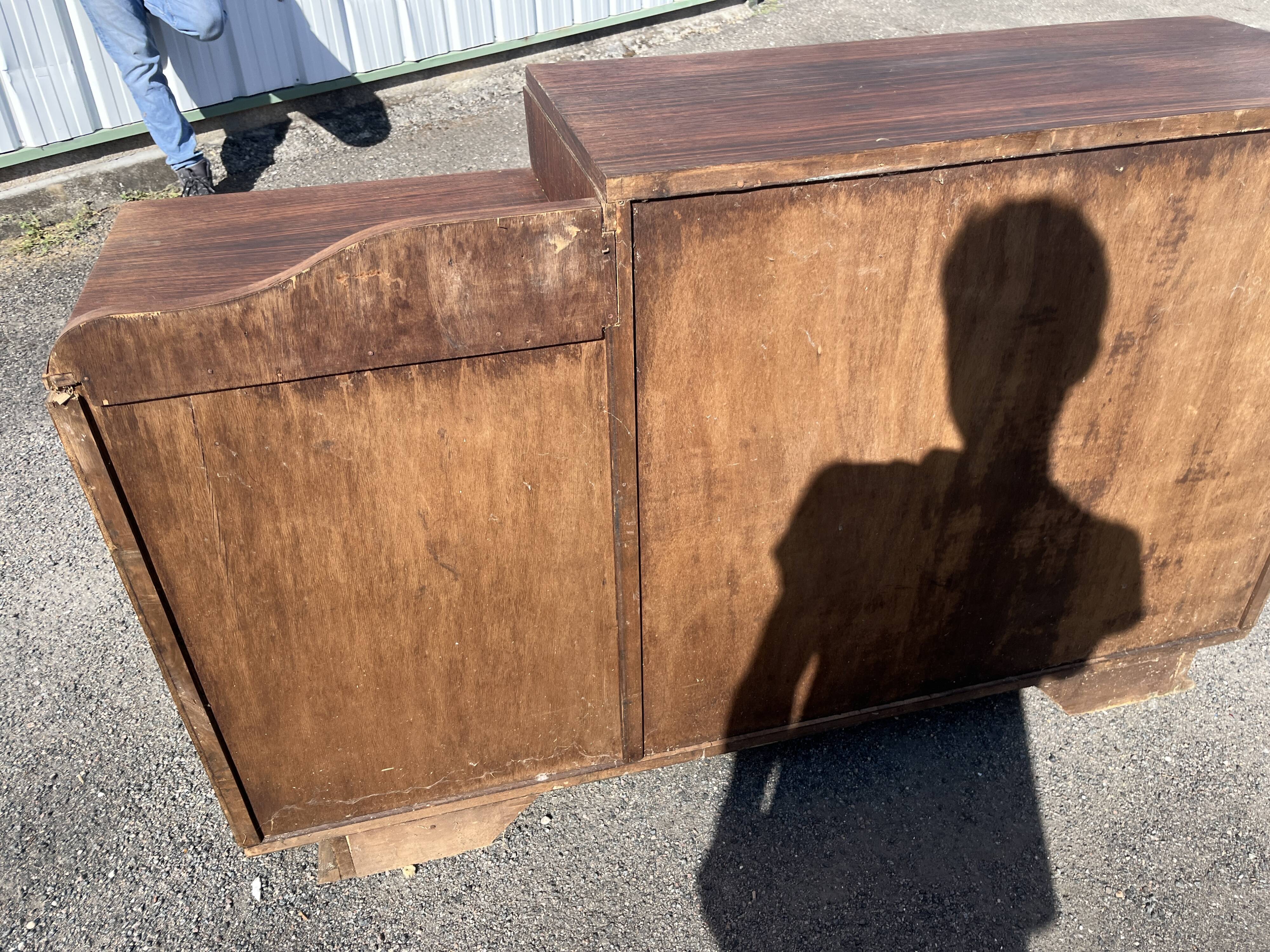 Asymmetrical antique Art Deco sideboard in rosewood veneer.