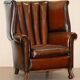 Victorian leather canapé and armchair, barrel back, circa 1860, restored.
