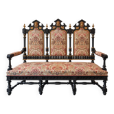 Historicist three-seater canapé in ebonised wood.