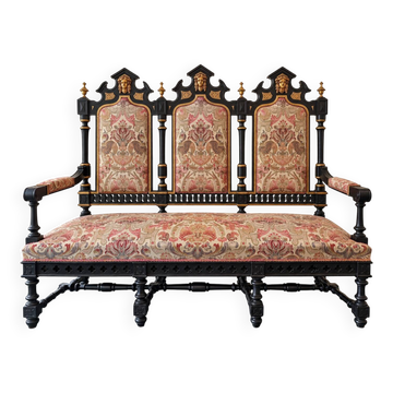 Historicist three-seater canapé in ebonised wood.