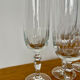 Set of 8 crystal champagne flutes in classic design.