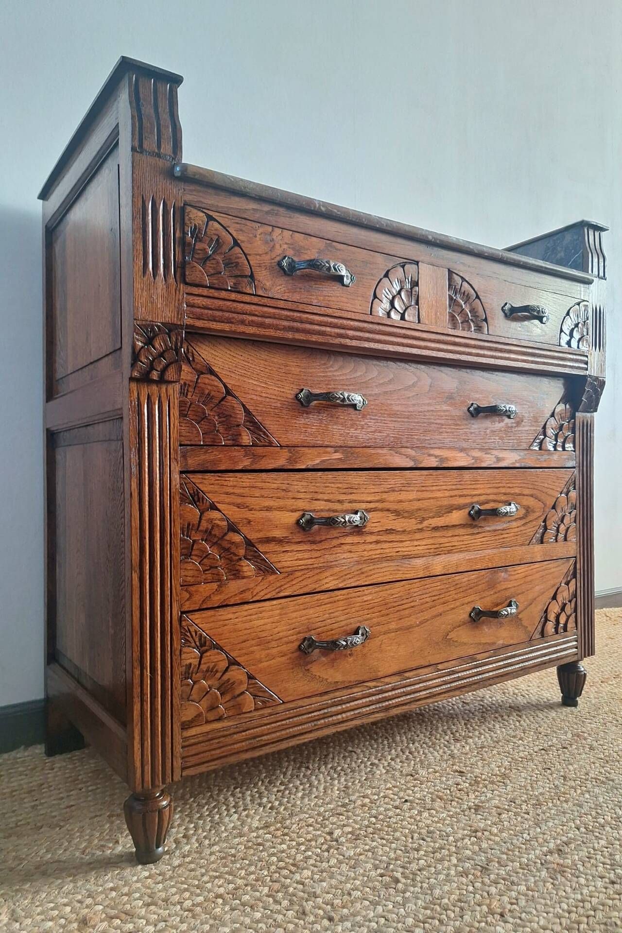 Art Deco commode with marble top, vintage antique furniture.