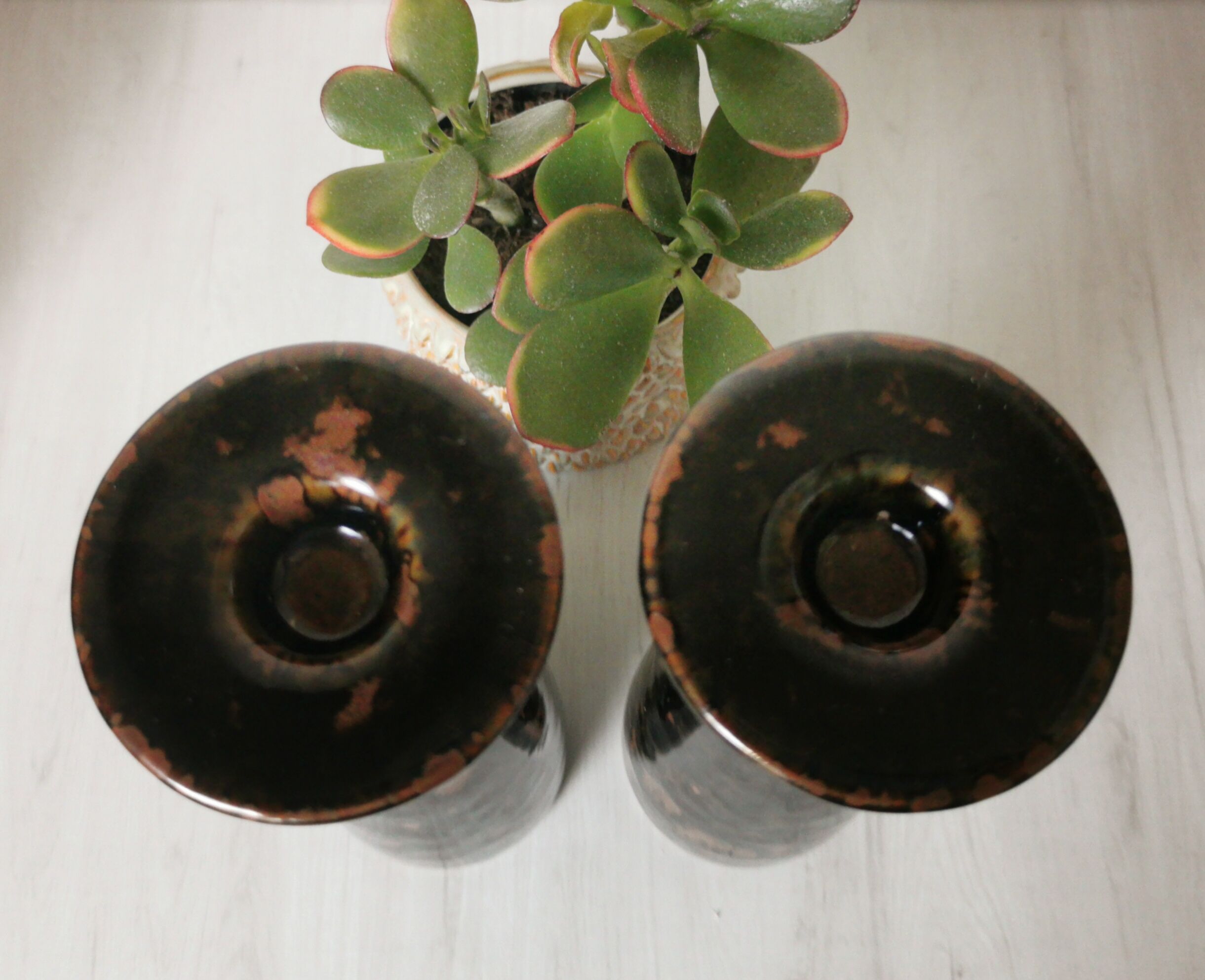 Pair of enamelled ceramic candlesticks