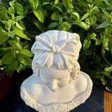 Bust of a woman signed Arnaldo Giannelli dated 1972.