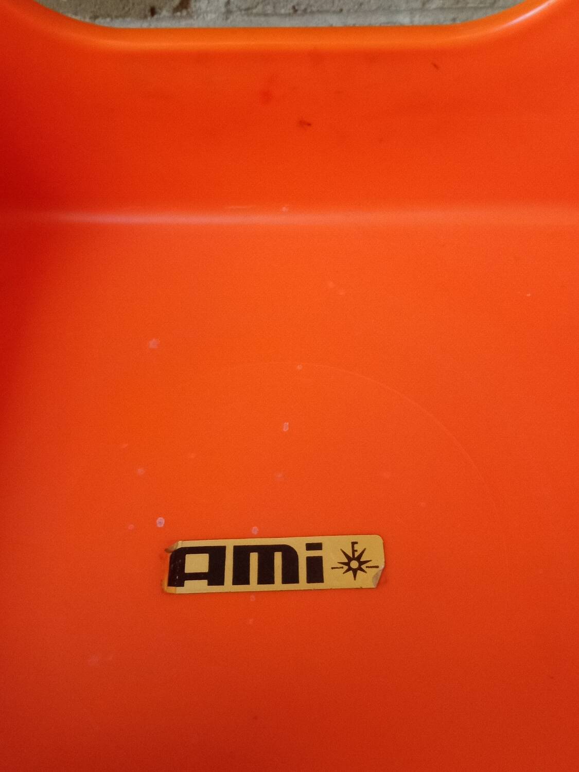 Pair of AMI stools in orange plastic
