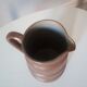 Vintage pitcher in glazed sandstone