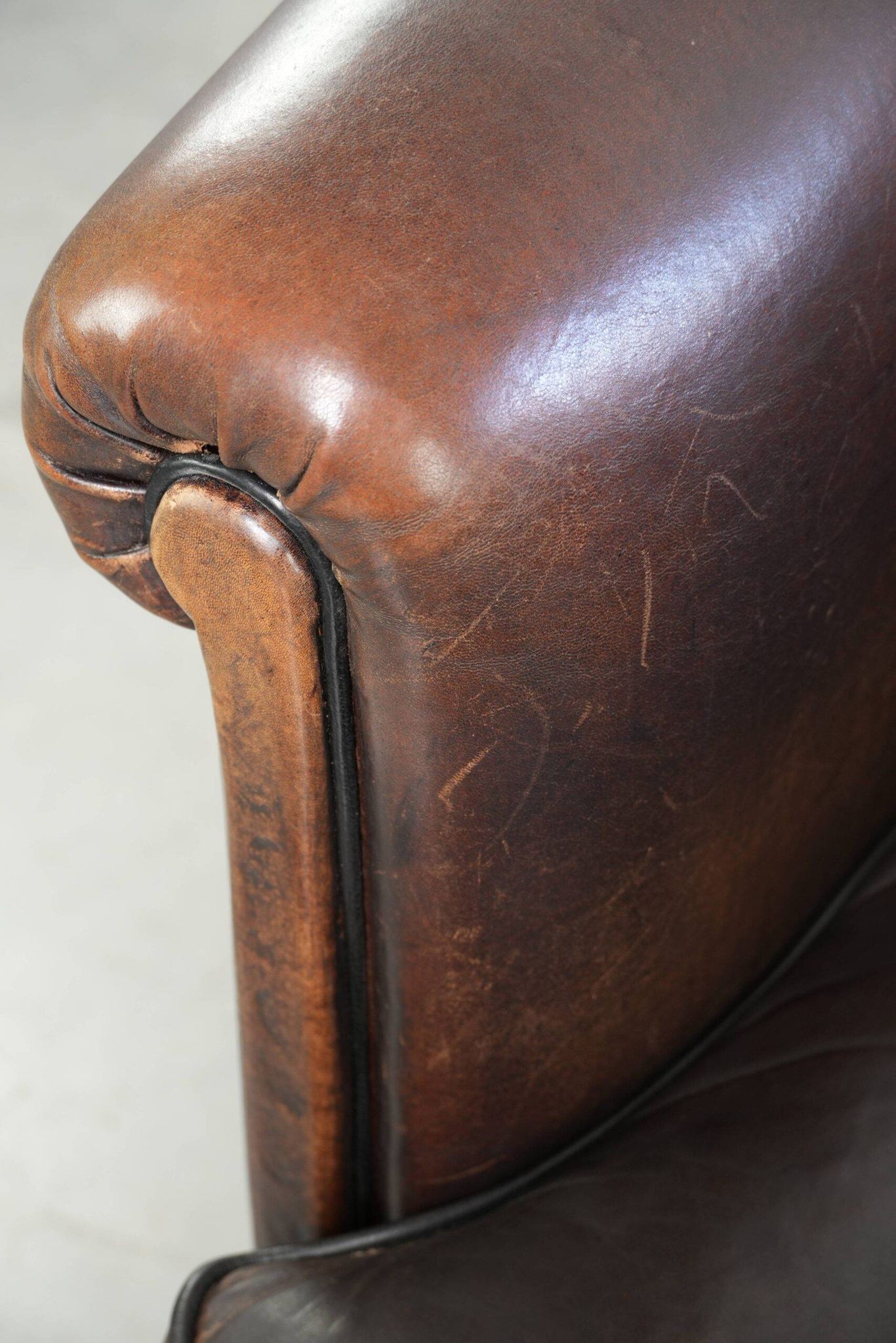 Dark sheepskin club armchair with unique design in English style
