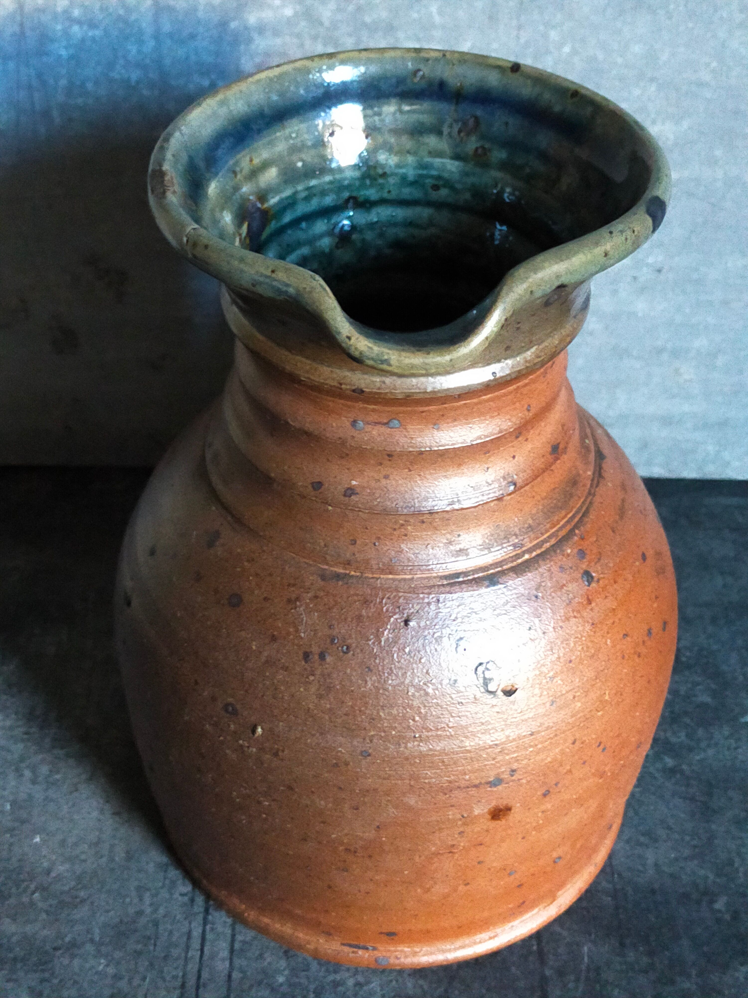 Pitcher traditional pottery Folk art in old enamelled sandstone