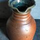 Pitcher traditional pottery Folk art in old enamelled sandstone