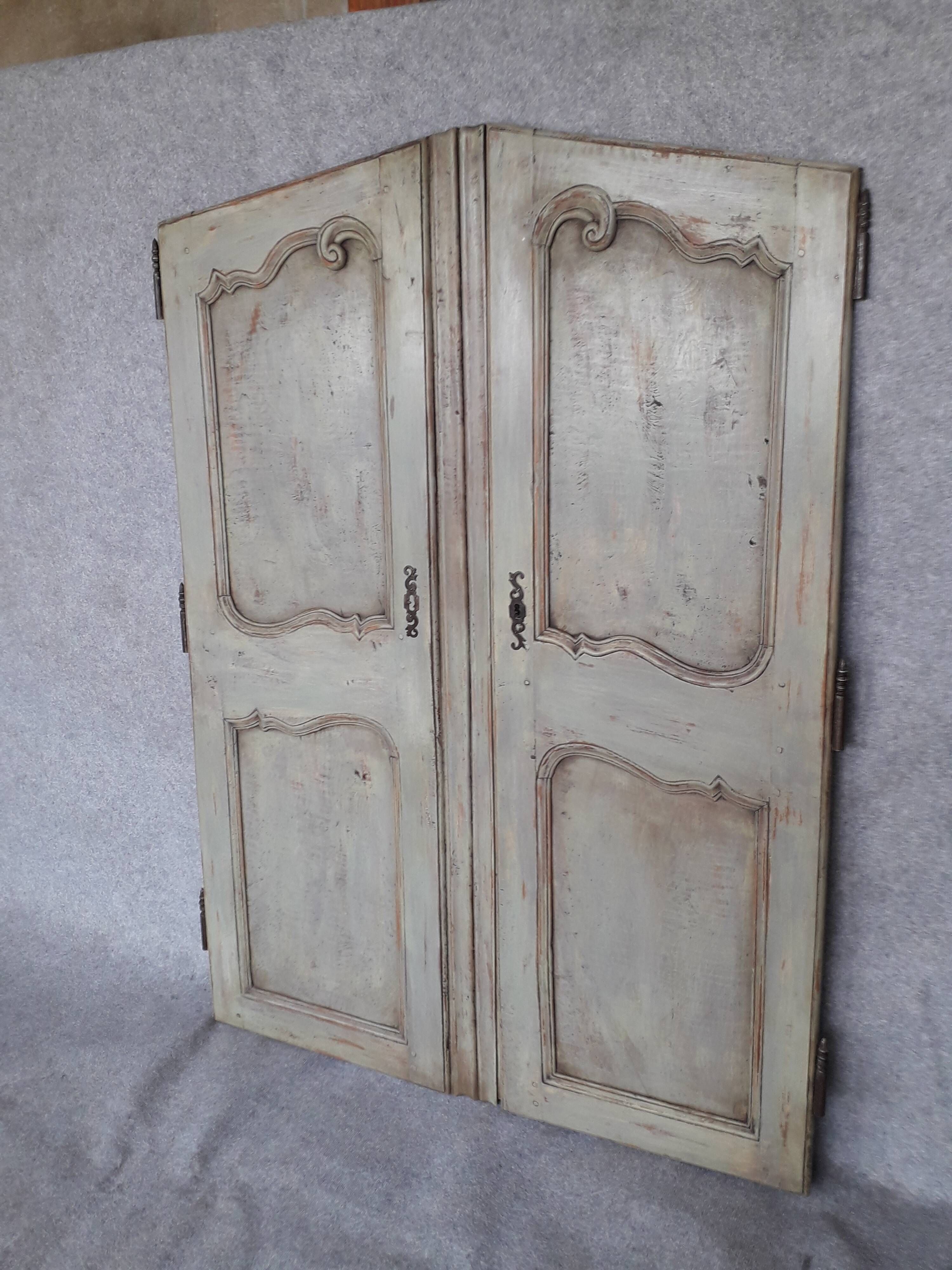 Pair of Louis XV period walnut and ash cabinet doors