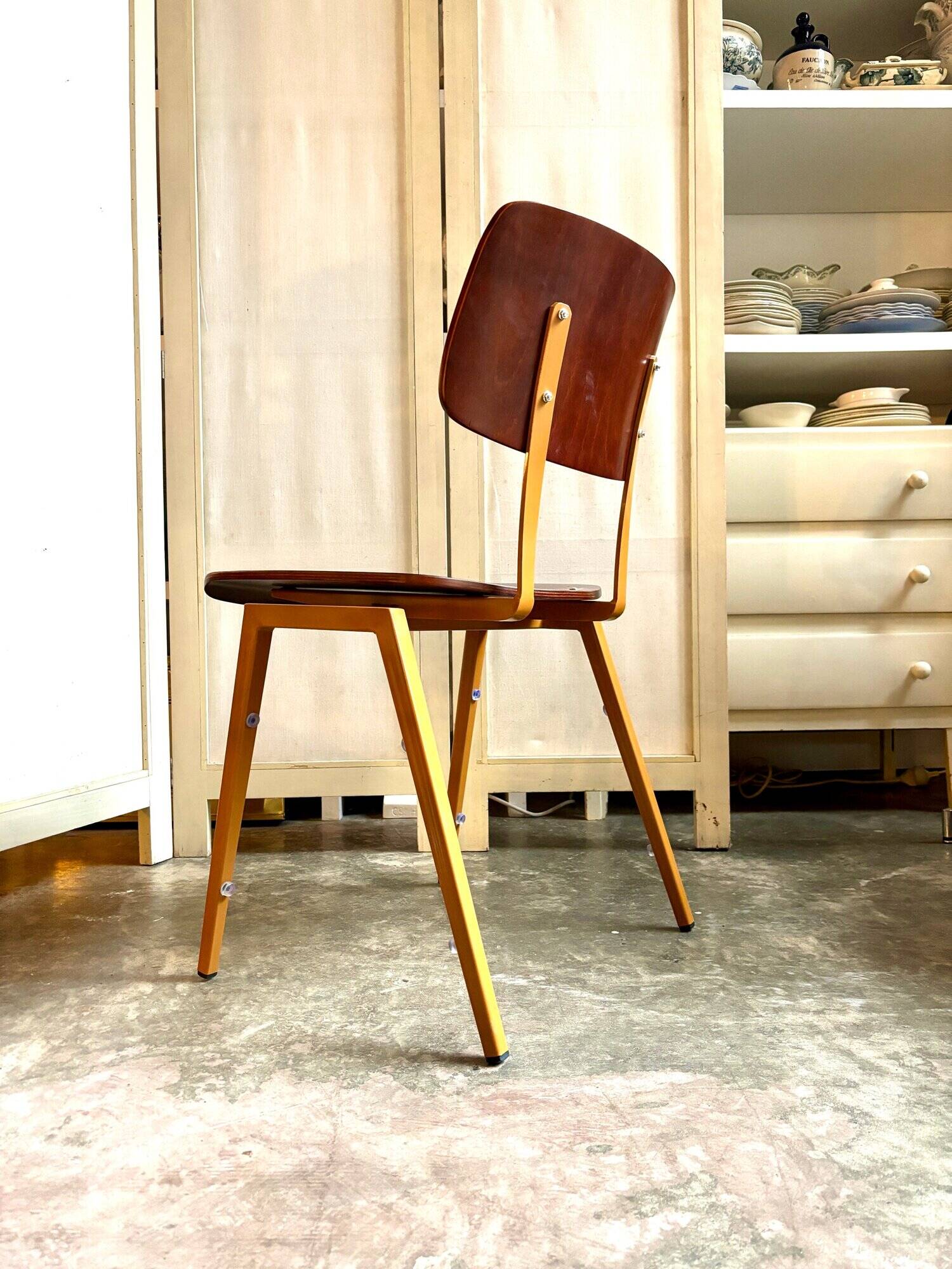Chair in dark wood and ocher metal