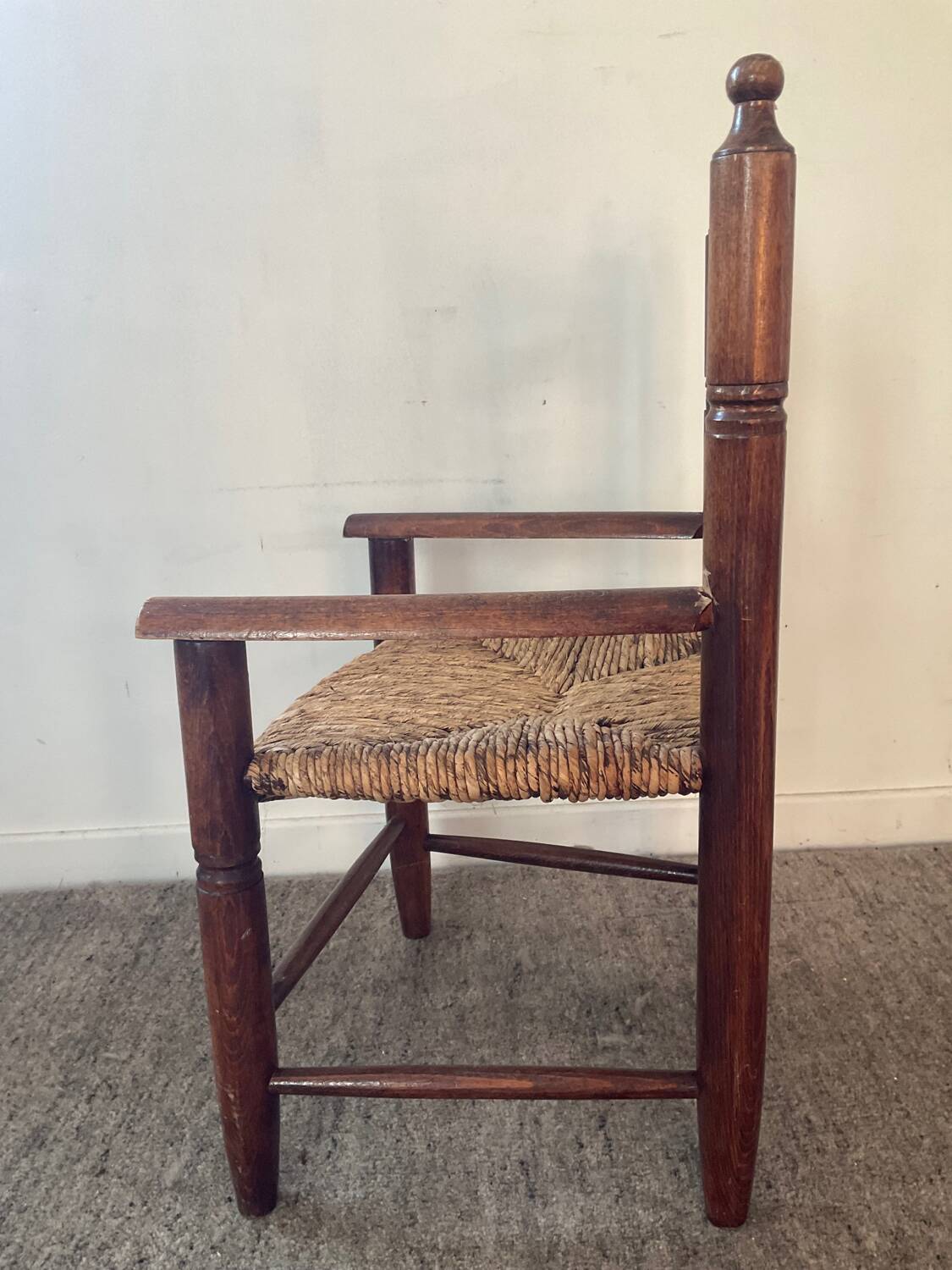 Vintage wooden armchair and straw seat for children