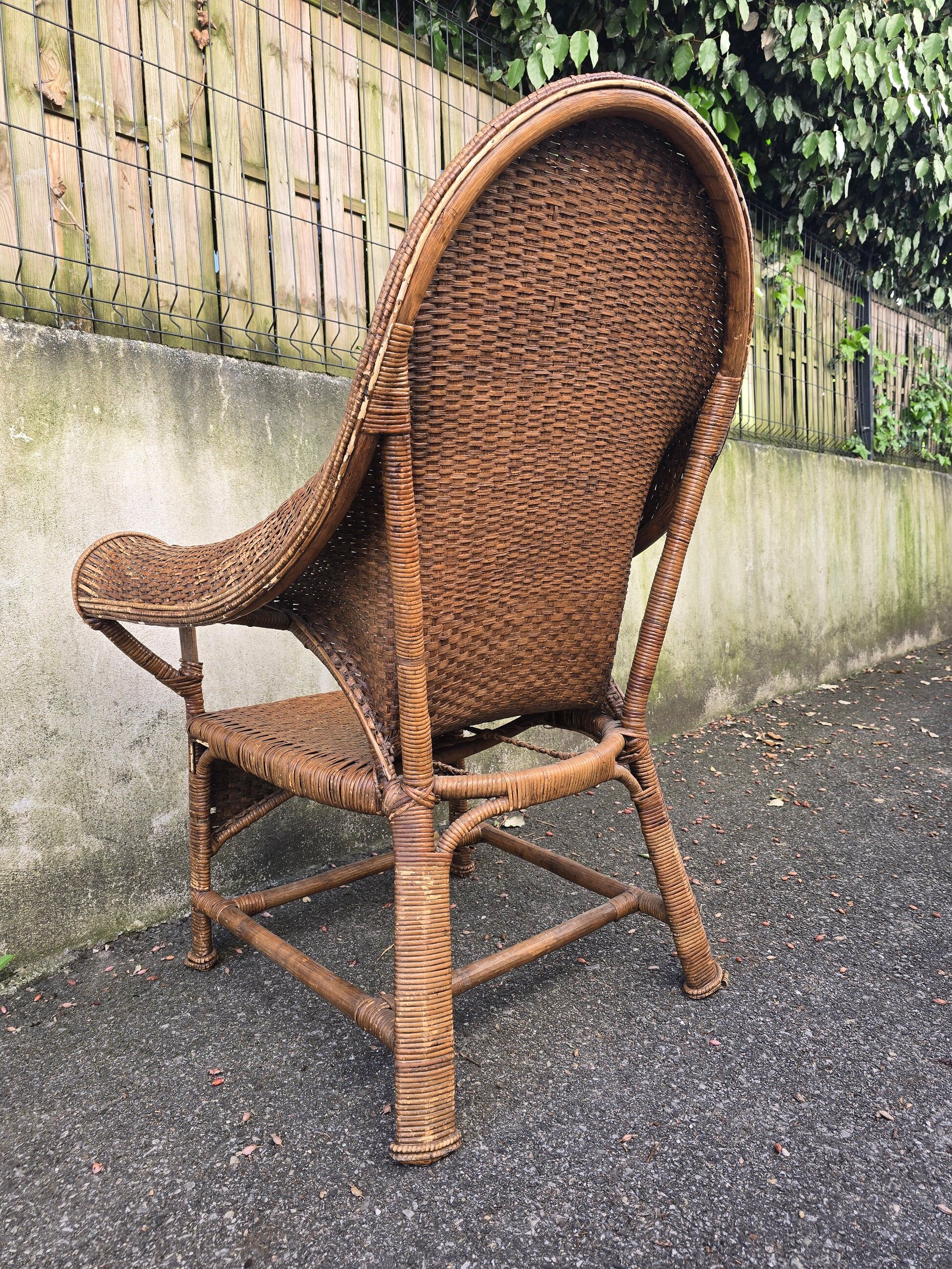 Arts & Crafts armchair in wicker and rattan attributed to Dryad & Co, UK, circa 1920.