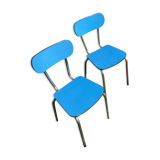 Two blue chairs in formica