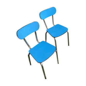 Two blue chairs in formica