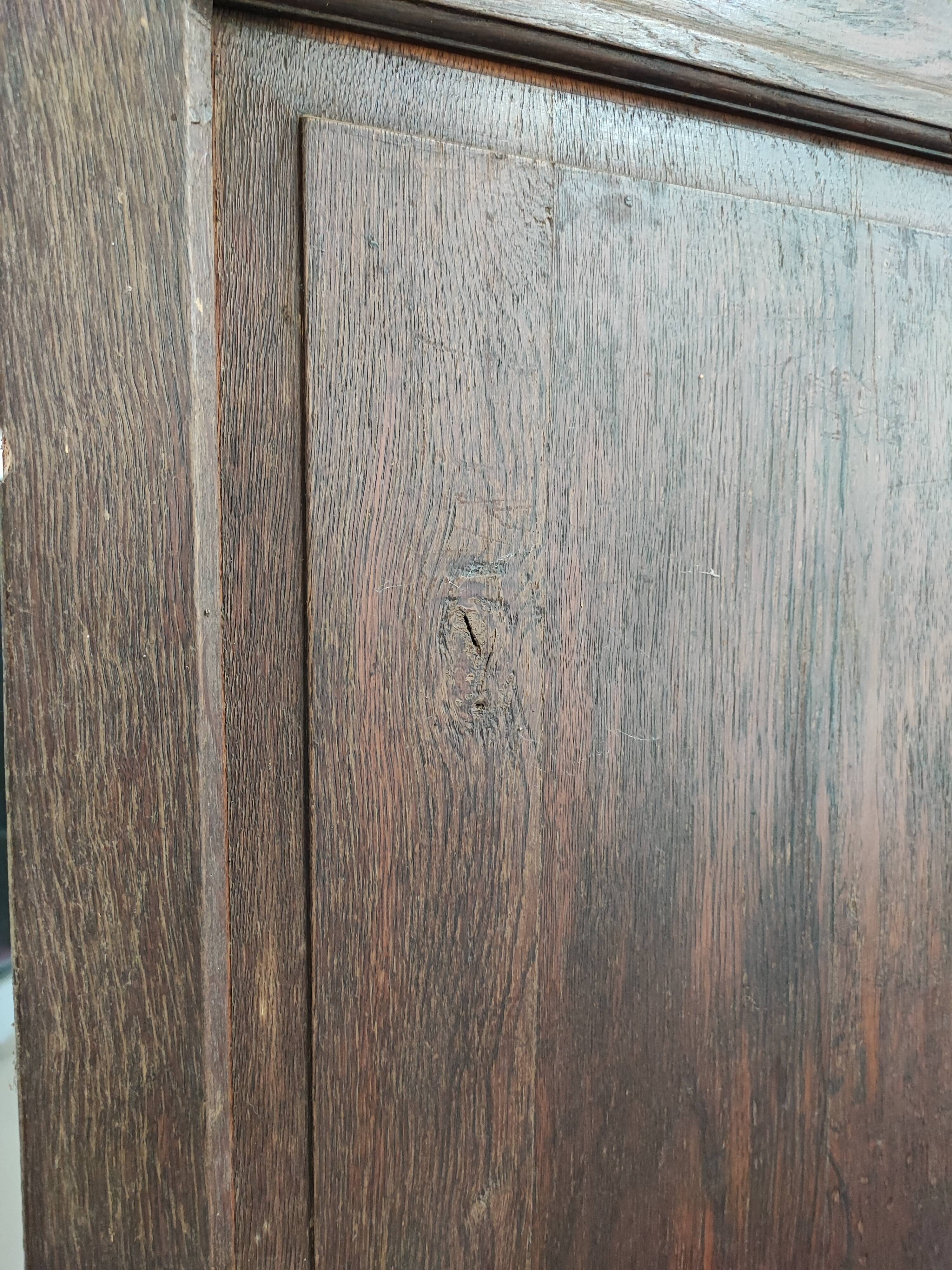 Bonnetière man standing cabinet a door