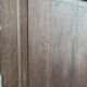 Bonnetière man standing cabinet a door