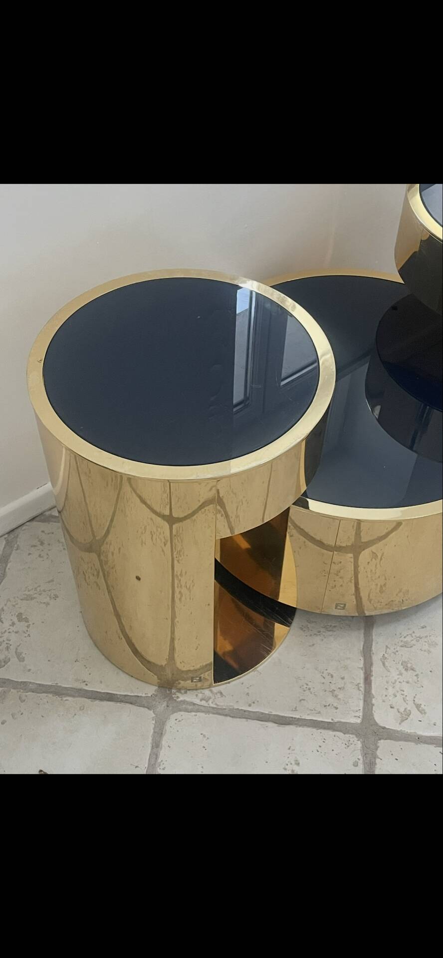 2 bedside tables and a brass Fendi table.