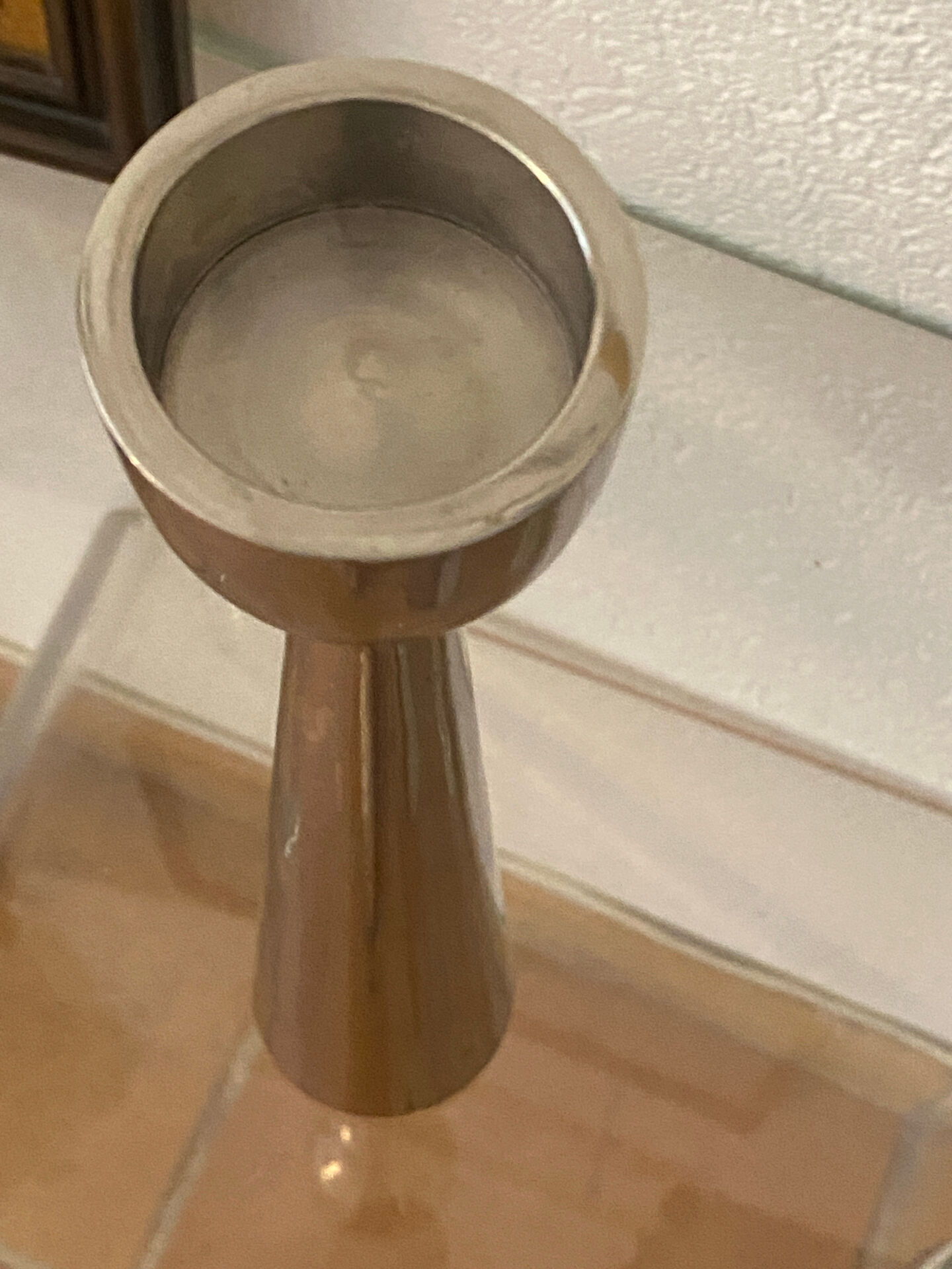 Pair of polished aluminium candlesticks