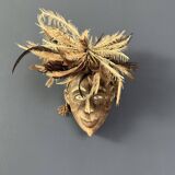 Tribal mask with feather head-decoration