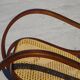 Vintage wooden rocking chair with caning