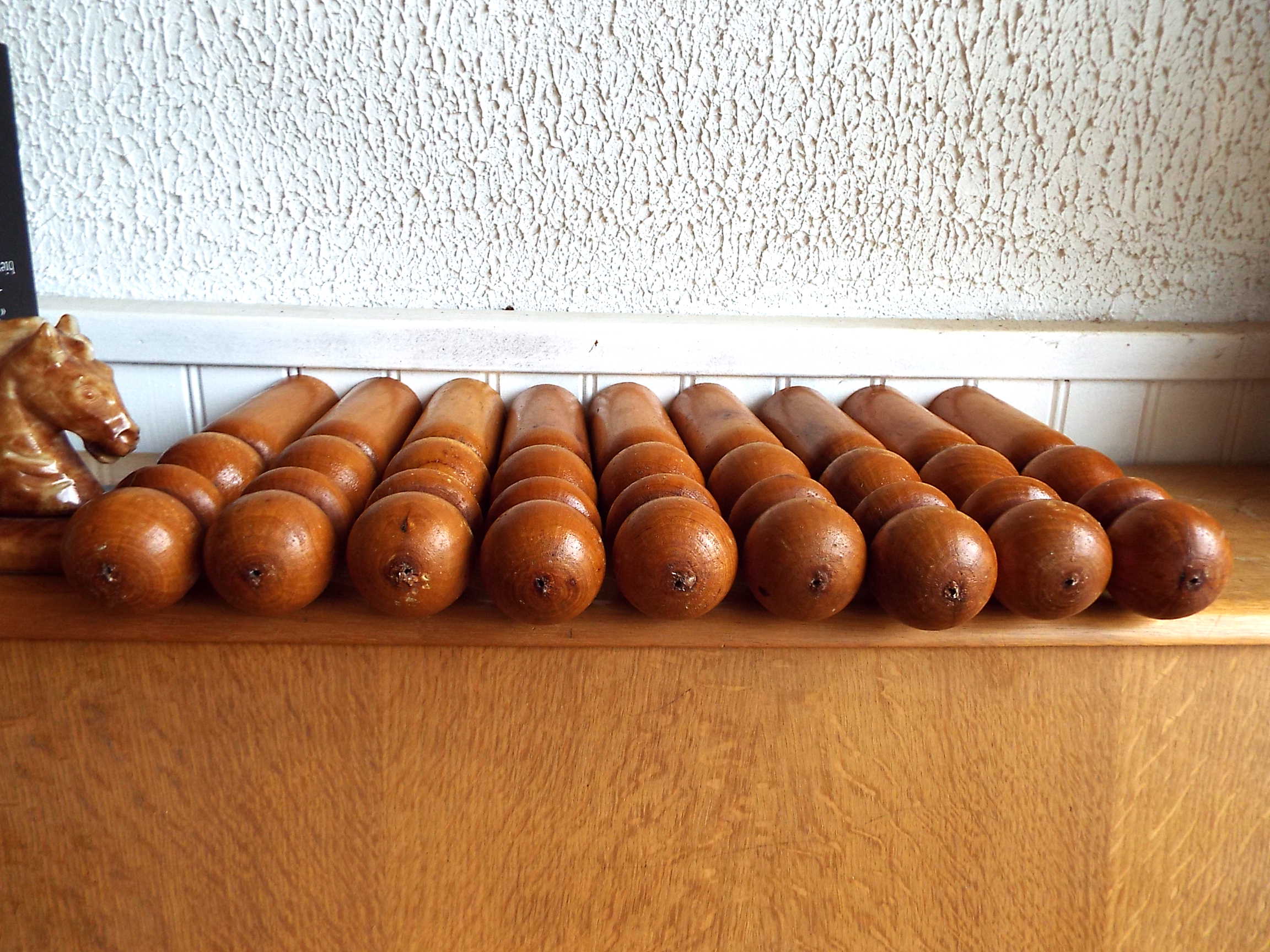 Set of 9 turned wooden pins