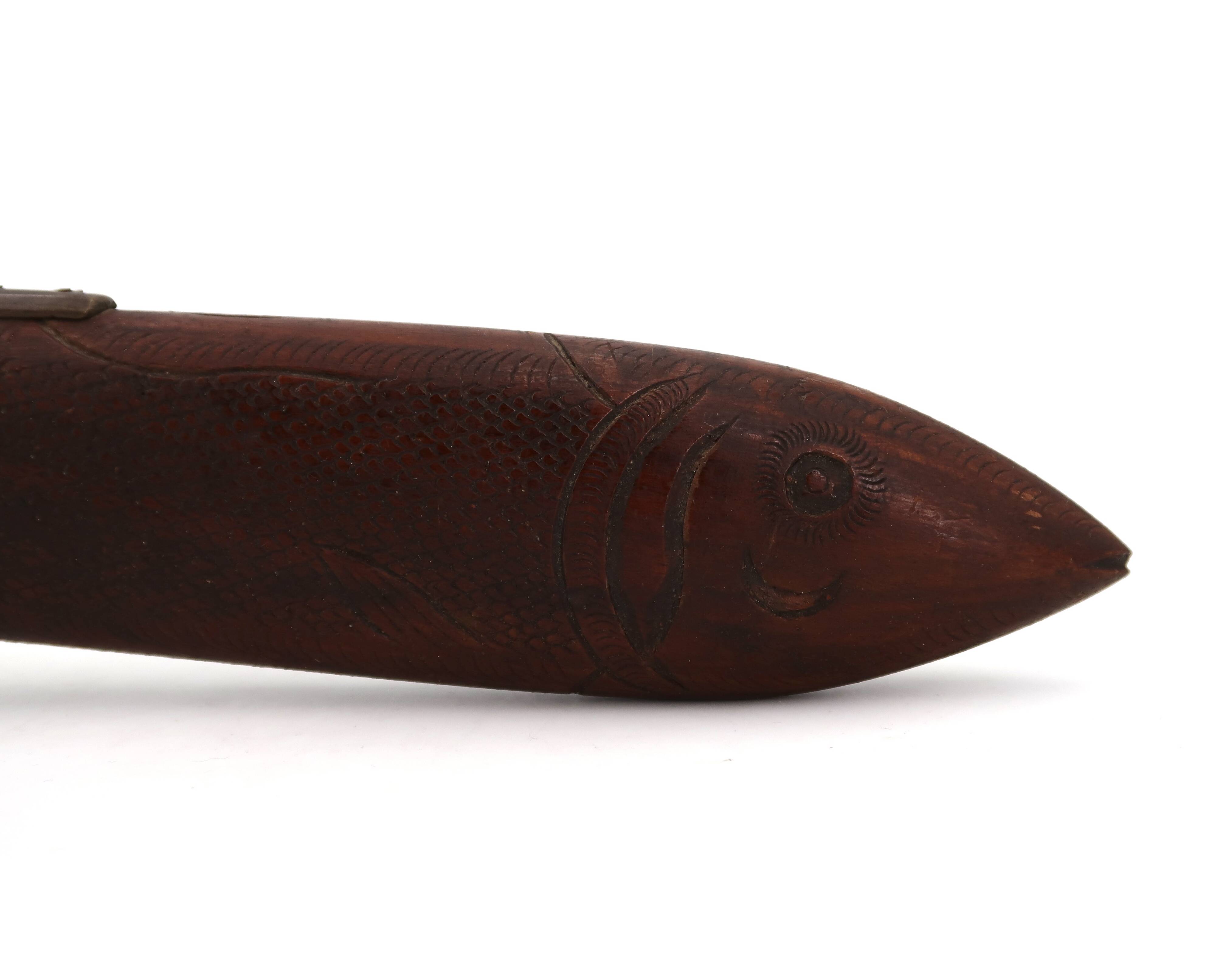 Fish knife and fork with a wooden and brass sheath sculpture.