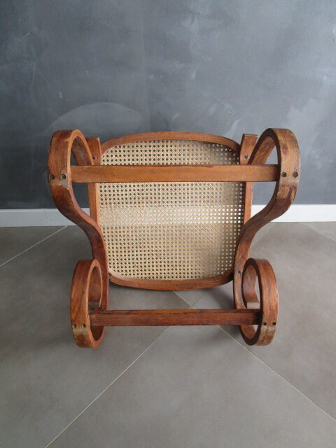 Old inclined footrest in bentwood, wood and canning