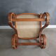 Old inclined footrest in bentwood, wood and canning