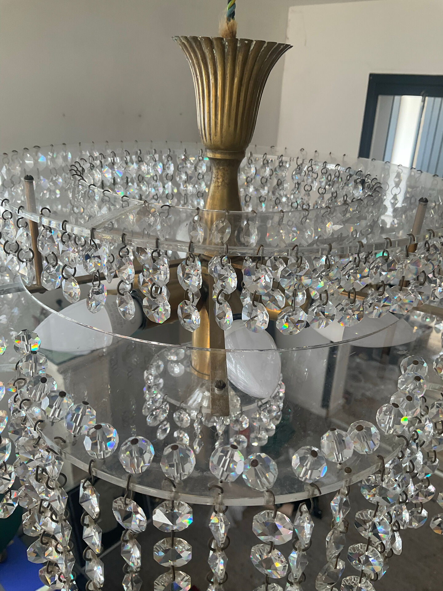 Vintage lucite chandelier with a cascade of crystal pendants from the 1970s.
