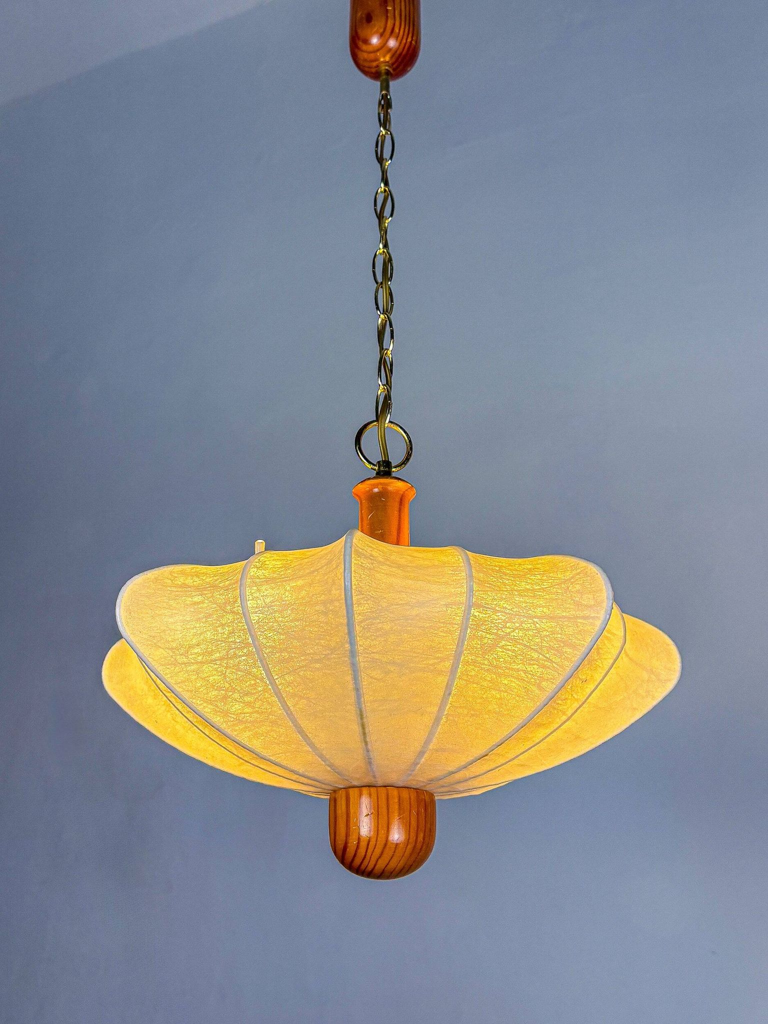 1960s Italian cocoon suspension, made of resin and pine wood.
