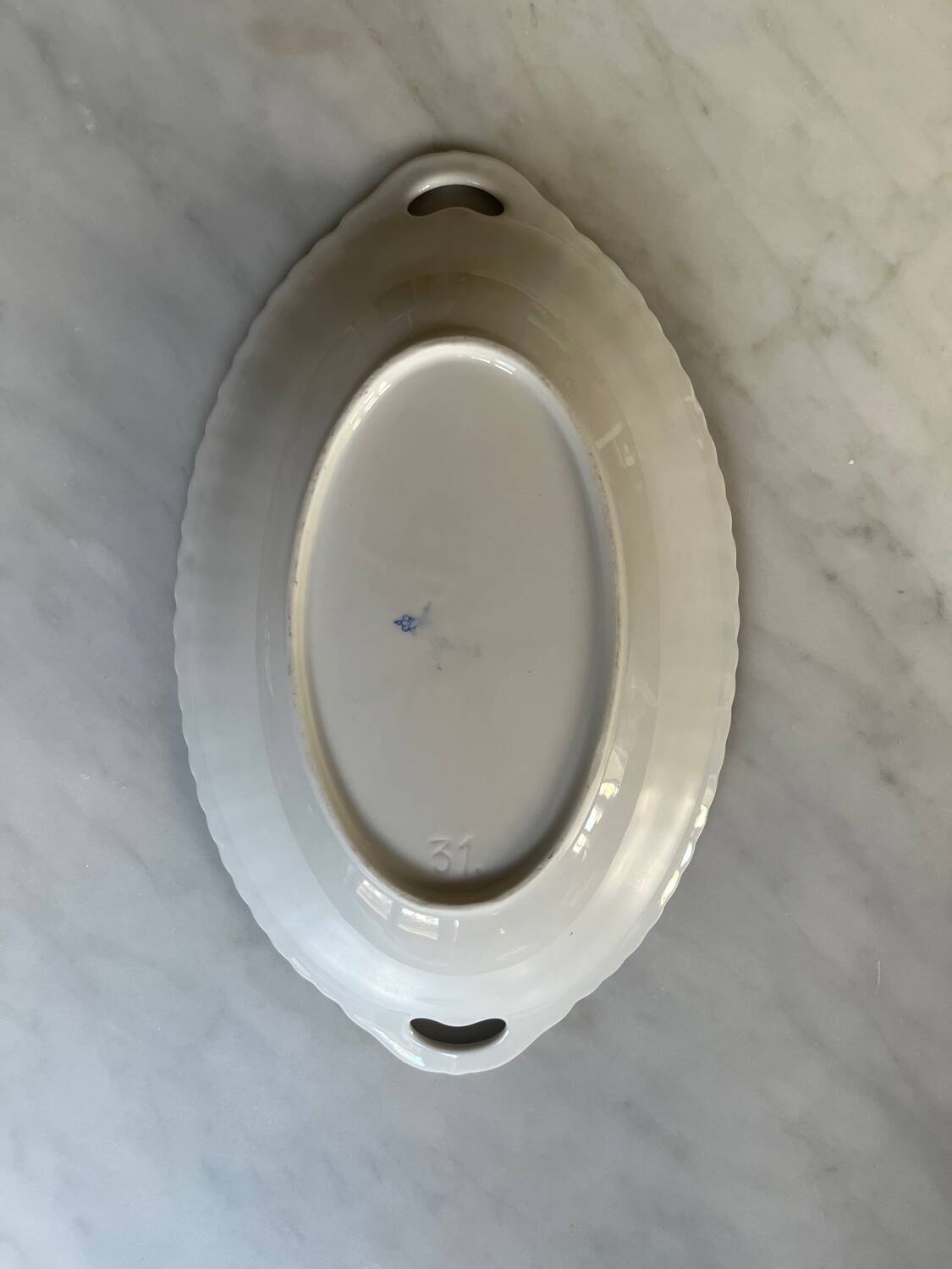 Antique oval dish with handles in earthenware