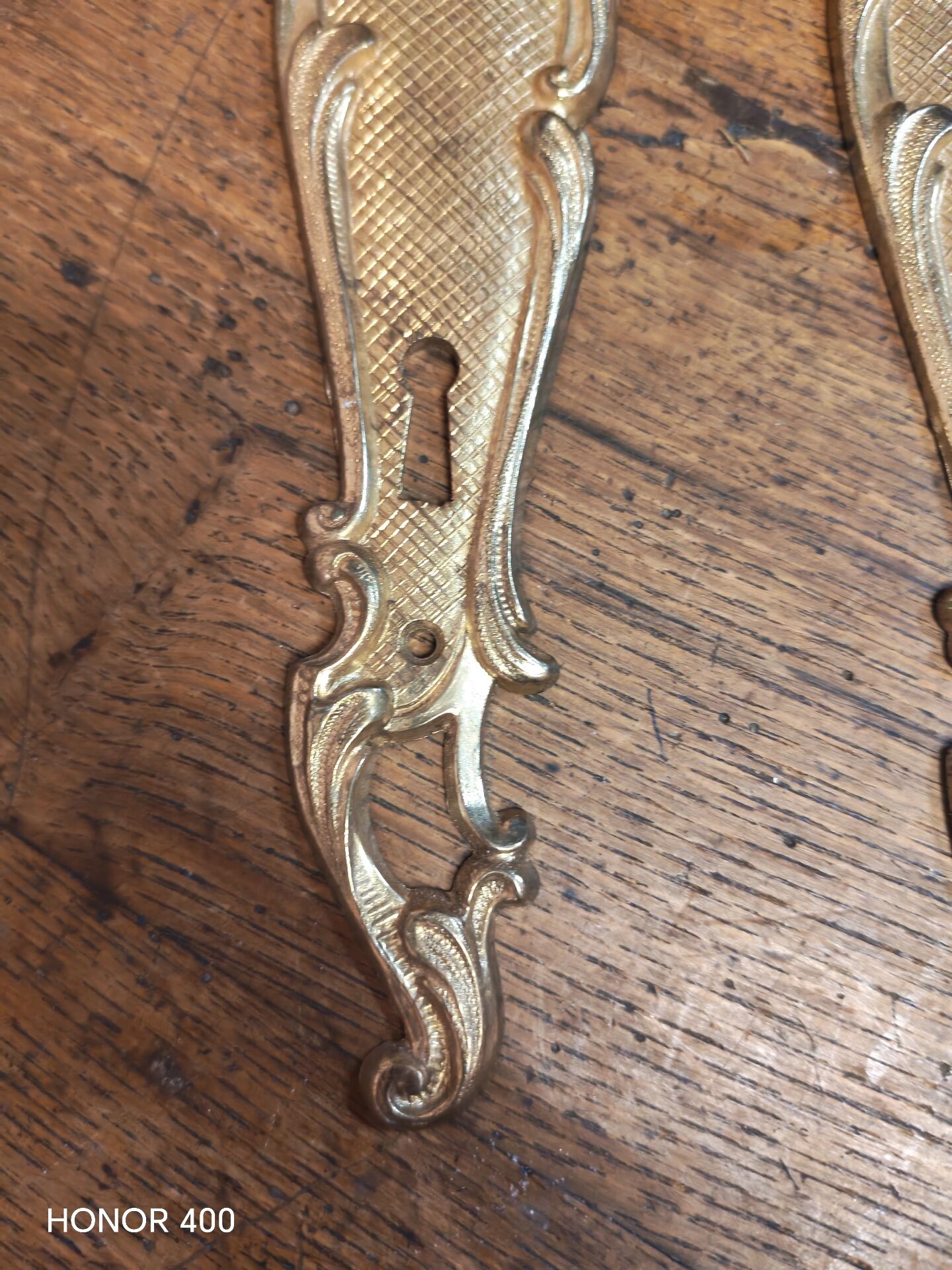 Pair of solid brass cleanliness plates in Louis XV rococo style.