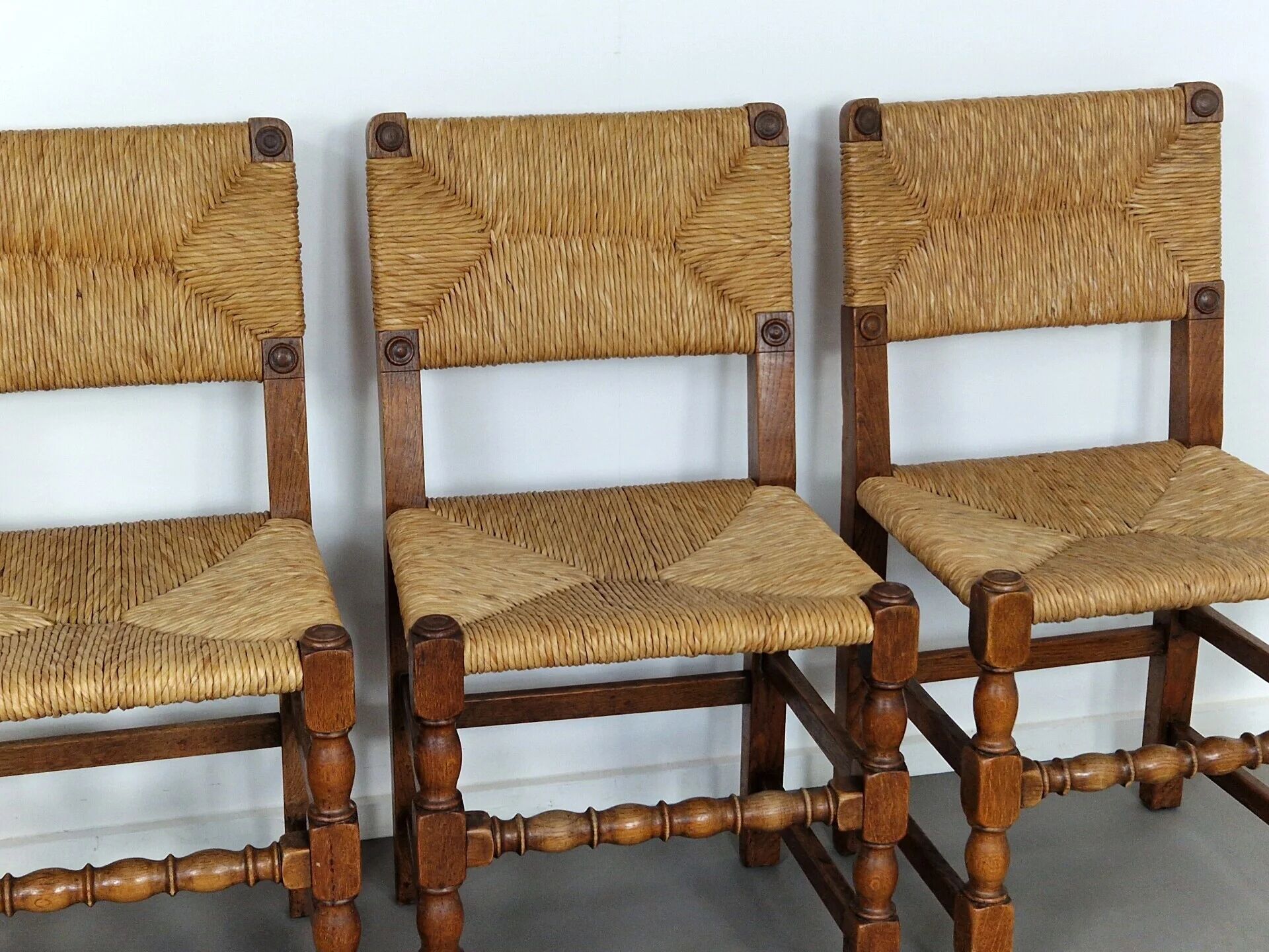 Set of French primitive rush chairs | 1930s