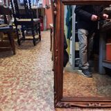 Mirror in golden wood