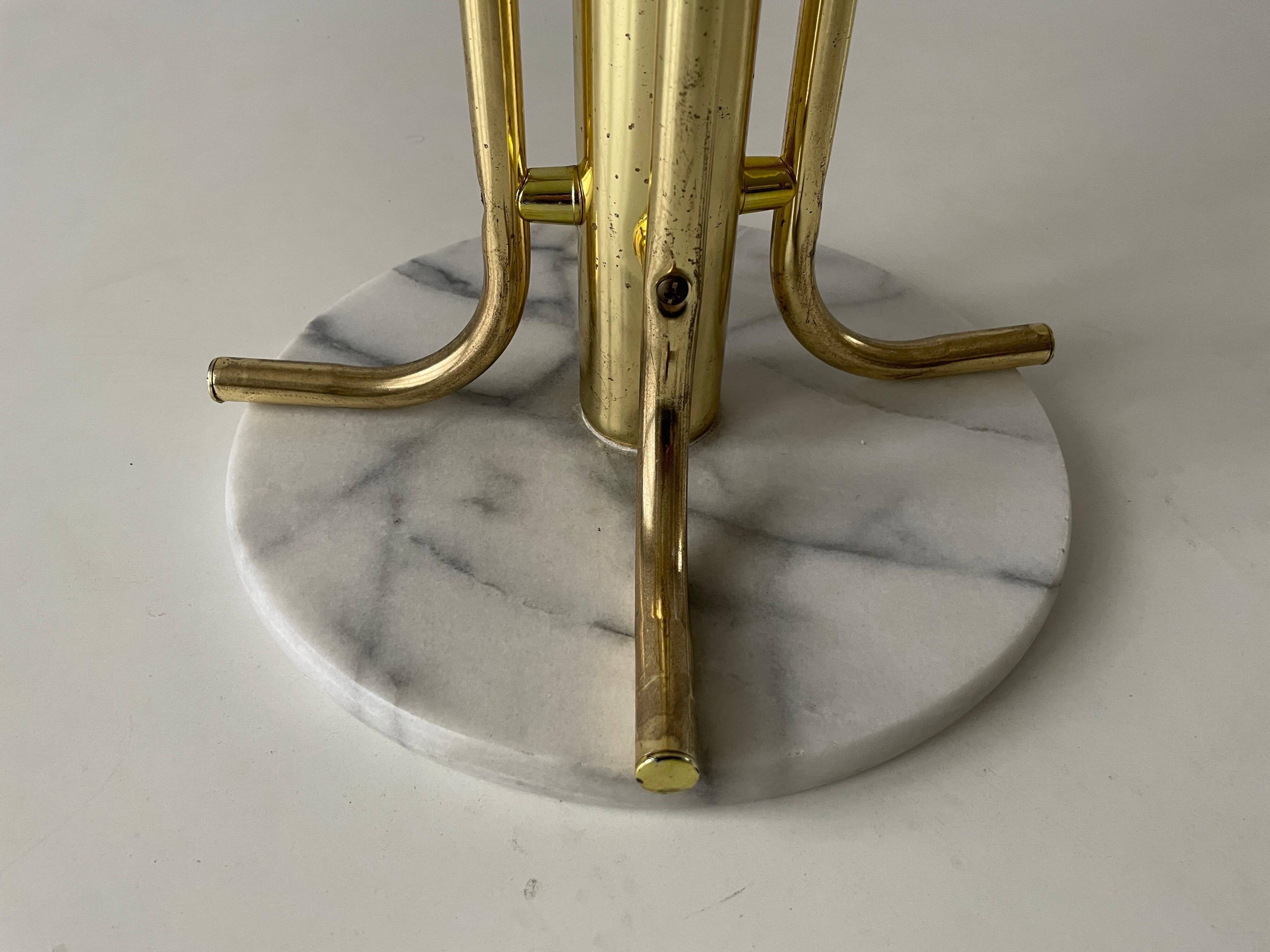 Free-standing coat rack in plexiglass with a marble base, 1960s, Germany.