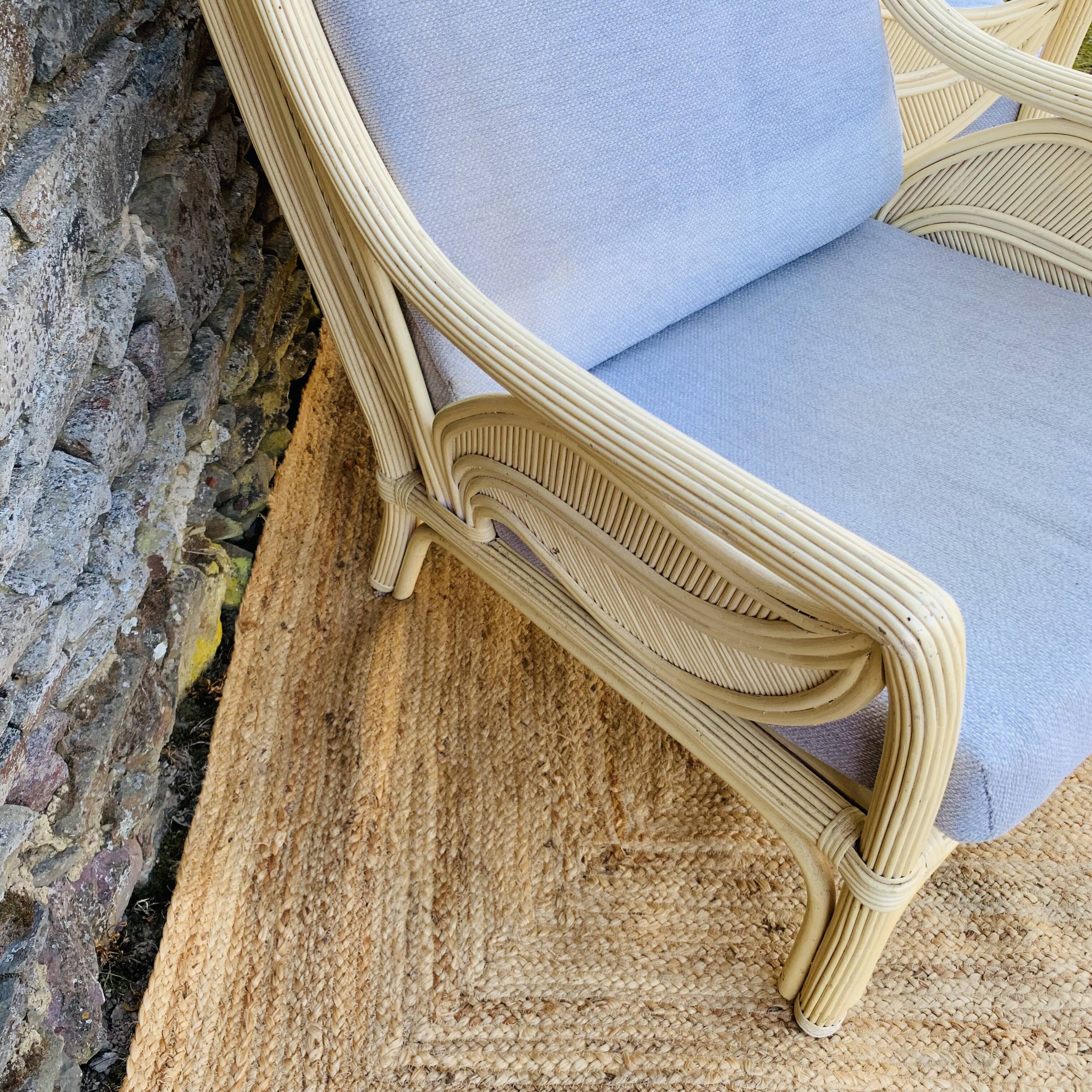 Pair of white rattan armchairs