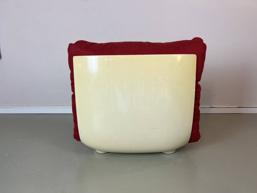 Vintage red shell lounge chairs from the 70s mid-century retro.