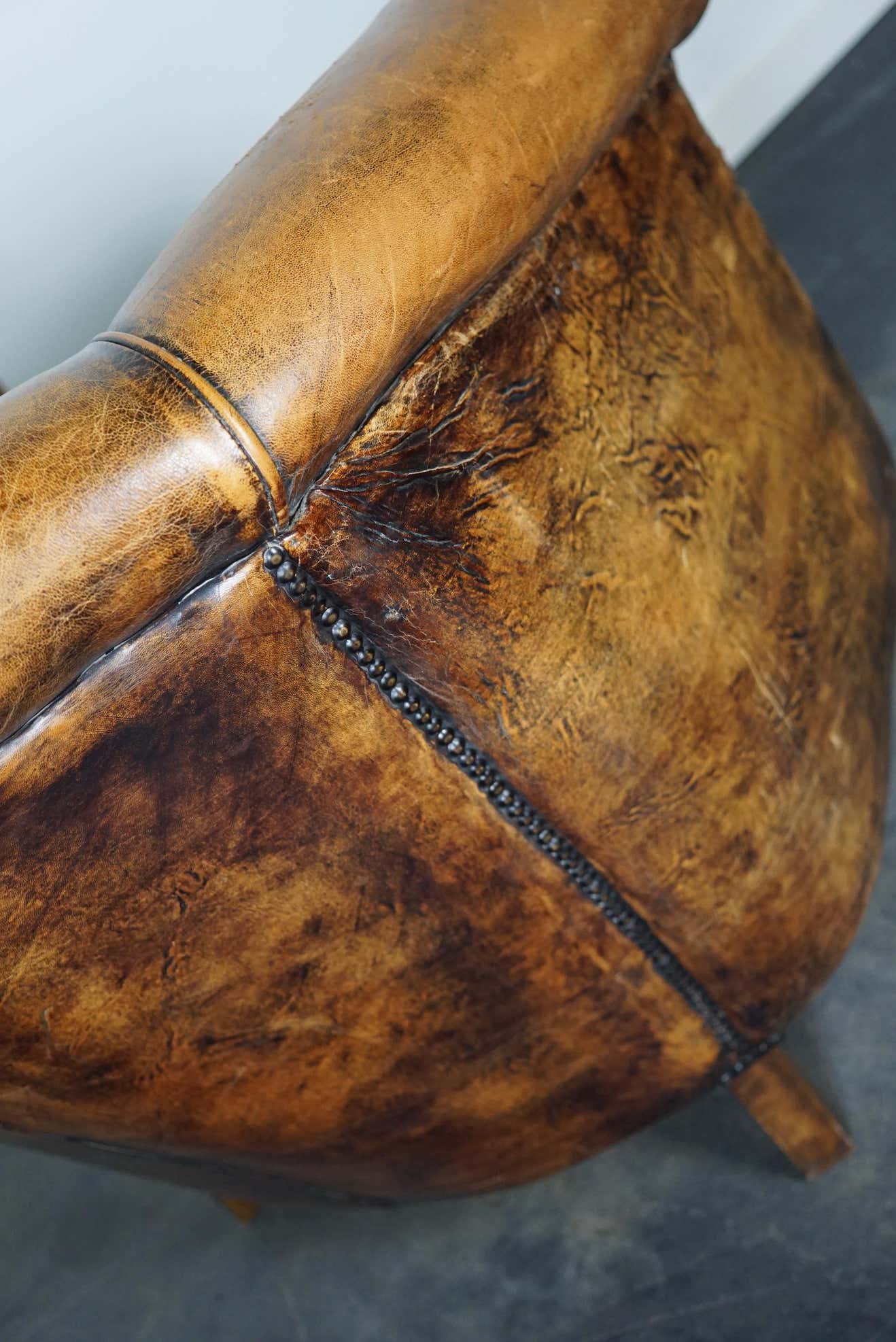 Vintage club armchair in leather color cognac Netherlands