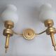 Three Empire style golden torch wall sconces
