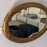 Art Deco oval mirror in gilded wood, France circa 1920