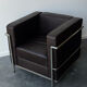 Pair of modernist brown leather armchairs